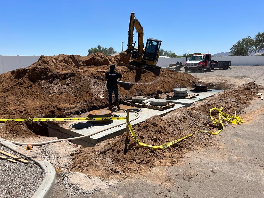 Large commercial septic tank installation with SewerTime crew on site