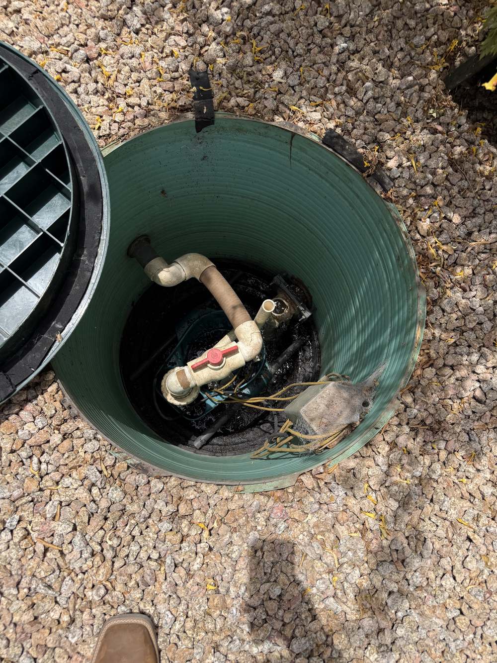 Open septic pump tank riser in Cave Creek AZ showing the effluent pump, floats, and shut-off valve
